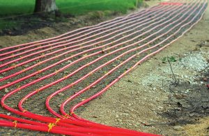 Rows of PEX, or Polyethylene crossed, tubing is placed under the sidewalks of Holland, Mich., to carry the heated water from the power plant to the downtown streets. (Photo provided)