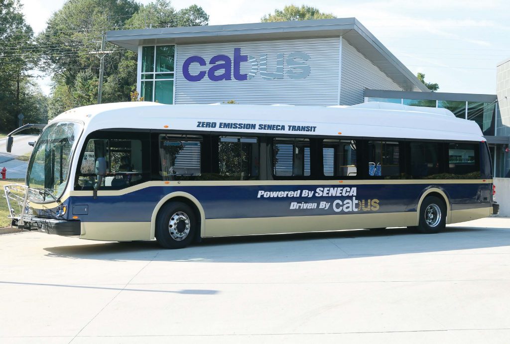 Seneca, S.C., has drawn visitors from all over the world and U.S. with its all-electric, batterypowered fleet of six buses — the first in the world. The buses have also brought sizable savings when compared to diesel buses. Pictured is one of the buses at Clemson Area Transit. (Photo provided)
