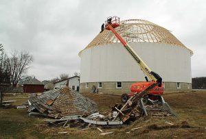 Further renovations were completed on this white round barn when a severe storm in August 2015 caused damage. These renovations include a new roof that was placed in 2016. (Finished roof: Provided; under construction: David Hazledine)