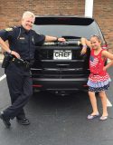 Chief Tracy Hahn poses with a potential future chief. (Photo provided)