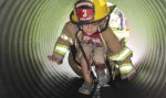 A potential future recruit for the Holland Fire Department participates in one of the activities held during Fire Prevention Week. (Photo provided)