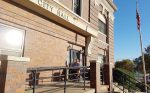 Seward City council member Richard Hans utilizes the accessible ramp at Seward City Hall. “The ramp meets both the requirements of accessibility while matching the historic aesthetic of the 108-year-old building,” said Greg Butcher, city manager. (Photo provided)