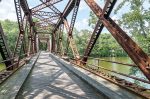 Many cities and towns are turning abandoned rail lines into community assets in the form of rail trails. Pictured is the Springtown Bridge, which crosses over the Wallkill River near New Platz, N.Y. It is a part of the Wallkill Valley Rail Trail. (Shutterstock. com)