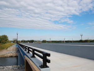 The newly reconstructed Harshman Road Bridge is wider and able to accommodate two lanes of traffic in each direction and also has a left turn lane. The community loves the addition of a dedicated bike lane, which is protected from traffic, and the put-in points for kayaks. (Photo provided)