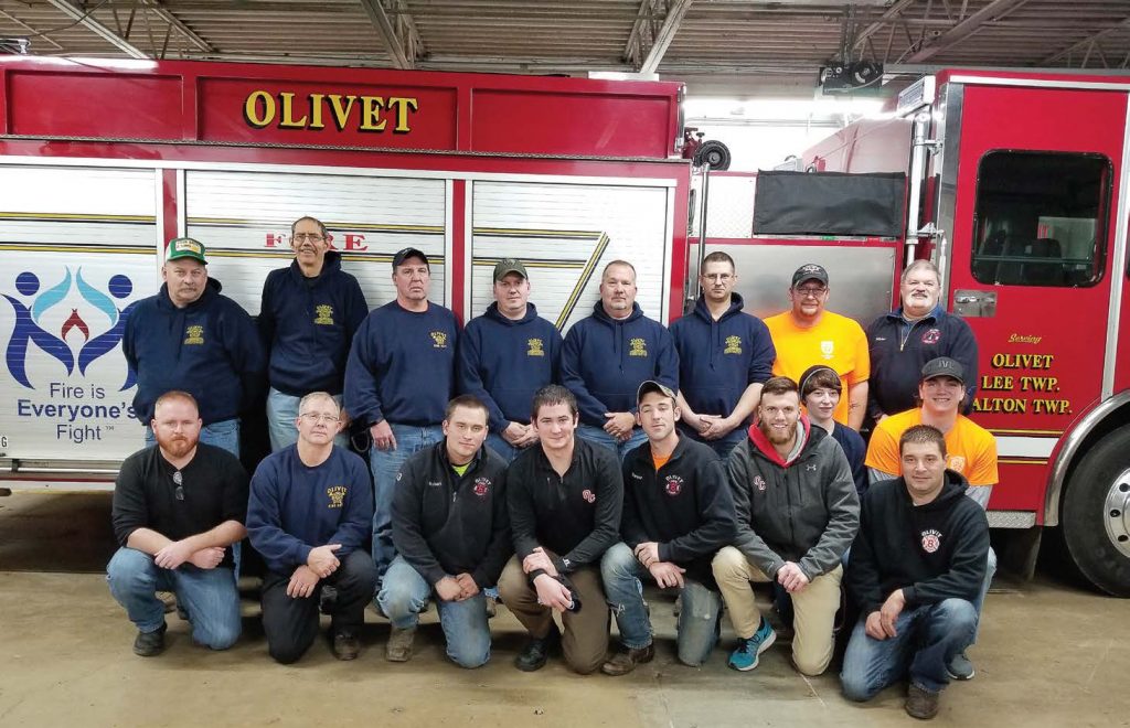 Pictured are members of the Olivet Fire Department. One key to retention has been utilizing new volunteers on proactive projects like installing new fire and carbon carbon monoxide alarms for free. These projects create goodwill in the community while also making volunteers feel valued. (Photo provided)