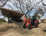 Kubota stepped up in the aft ermath of Hurricane Harvey, donating $1 million in relief funds and equipment to several national and local charitable organizations. Pictured is a Kubota tractor removing debris from Hurricane Harvey. (Photo provided)