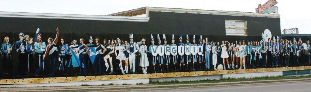 The mural titled, “Marching Blues: The Virginia Marching Band Through Time,” contains the likenesses of high school band members through the years. (Photo provided)