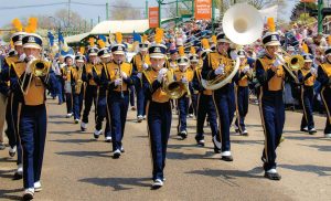 A marching band performs in the Tulip Time Festival, which draws in crowds of more than half a million. (Photo provided)