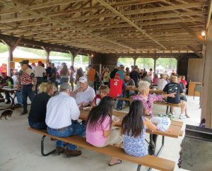Festival participants enjoy the food available during Barton City’s two-day Fourth of July celebration. (Photo provided)