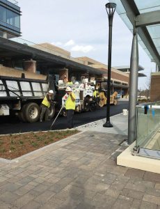 Workers pave Galambos Way, the roadway that Sandy Springs City Hall calls home. (Photo provided)