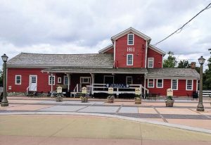 The historic Williamsville water mill was restored as part of the East Spring Street Project. It was purchased by Sweet Jenny’s Ice Cream, and a plaza was built for events and gatherings to help make it a hub of the village once more. (Photo provided by the village of Williamsville)