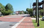 Kennesaw, Ga., passed ordinance Sec. 34-21 in 1982, which mandates that residents own a gun; however, the city included plenty of loopholes so residents actually don’t have to own one. Pictured is Kennesaw’s Main Street. (Public domain)