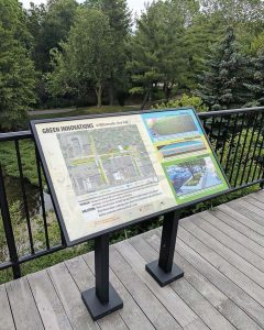 A sign that explains the problem, changes and solutions sits atop the overlook at Glen Park. It outlines the green innovations the village completed in order to better its stormwater management. (Photo provided by the village of Williamsville)