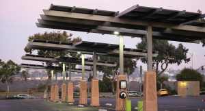 EV stations have a 10-year or more life span and are pretty low maintenance. With a networked station, there are over the air upgrades that occur throughout the life of that station. Pictured is a solar-powered EV station in a public parking lot in San Diego, Calif. (Joshua Rainey Photography/Shutterstock.com)
