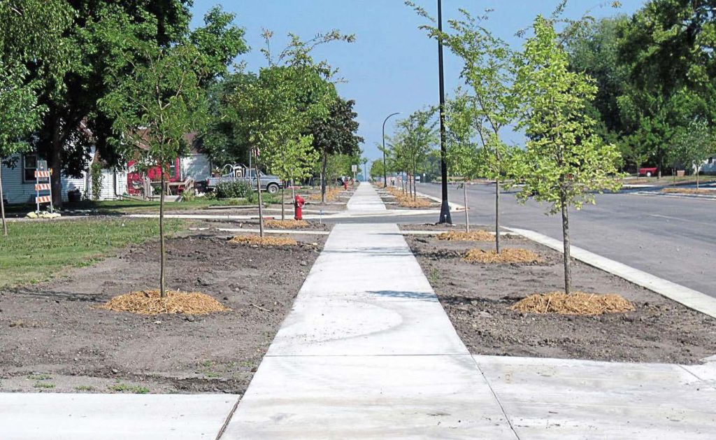 Sidewalks across the country are expanding to improve pedestrian safety while roadways shrink. These smaller roads improve drivers’ safety, too, by encouraging them to pay more attention. (Photo provided)