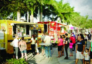 People line up at a variety of food trucks to sample their wares during a concert at the Wellington Amphitheater. (Photo provided)