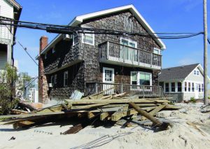 Homes along the beach in Seaside Heights, N.J., had downed utility lines and piles of boardwalk planks in their yards — if they were lucky enough to escape being damaged in the devastation left from Hurricane Sandy. The borough along the coast had a double whammy when several months later a fire took out nine blocks of boardwalk. (Photo provided)