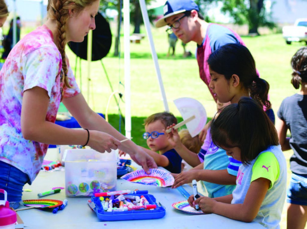 Children complete art projects during one of the summer block parties. (Photo provided)