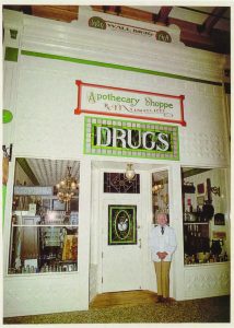 Wall Drug founder Ted Hustead poses in front of the Apothecary Museum, a replica of the original drug store founded in 1909, two years aft er the town’s founding. Hustead purchased the store in 1931. (Photo provided)