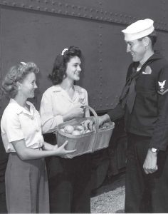 Young women, 16 and older, served as “platform girls” who would greet the soldiers debarking from the troop trains during brief refueling stops.