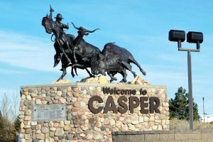 “CY Right of Way” is the Westside Gateway located at the intersection of Wyoming Boulevard and Highway 220, and it portrays the dedication of Wyoming cowboys driving stray steers along the North Platte River toward the C.Y. Ranch House. (Oscar C. Williams/ Shutterstock.com)