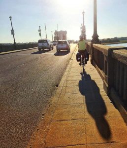A cyclist travels on a maintenance path in Charleston, S.C. The city and Charleston County hope to install a pedestrian bridge to further separate motor vehicles from cyclists and pedestrians. (Photo provided)