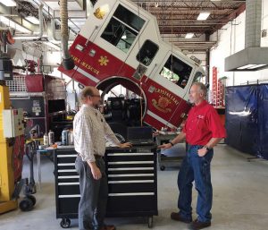 Since the city owns and maintains 326 vehicles and other pieces of equipment, its primary goal is to ensure that the vehicles are safe, reliable and perform their necessary functions. Pictured are Michael Magnuson, left, director of public works, and Don Christenson, fleet and facility services superintendent. (Photo provided by the city of Crystal Lake, Ill.)