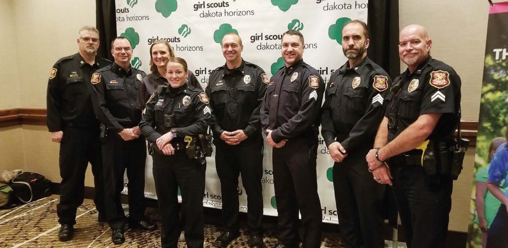 Several members of the Rapid City Police Department attended a Girl Scout Dakota Horizon’s Women of Distinction luncheon in November 2018. Members of the department make a concentrated effort to be involved in their community and welcome community members into the department. From left are Capt. James Johns, Lt. Eli Diaz, Jenni Clabo, Sgt. Kathleen Phillips, Asst. Chief Don Hedrick, Sgt. Ryan Phillips, Sgt. Warren Poches and Sr. Ofc. Fred Baxter. (Photo provided)