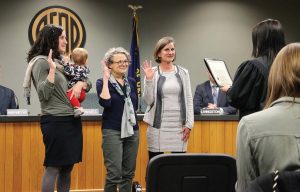 Sally Russell, right, takes the oath of her new offi ce as the fi rst elected female mayor of Bend, Ore., alongside councilors, from left ,Gena Goodman-Campbell and Barb Campbell. (Photo provided)