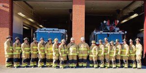 Wilton volunteer firefighters pose with their new turnout gear. (Photo provided)