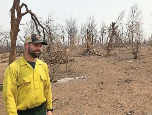 Jason Forthofer, mechanical engineer, stands in an area burned by the Carr Fire, one of the devastating California wildfi res in 2018. (Photo provided by Bret Butler, U.S. Forest Service)